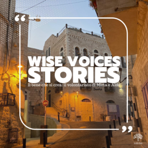 Foto di città palestinese con scritta "wise voices stories: il bene che si crea: volontariato di Mirta e Aldo"